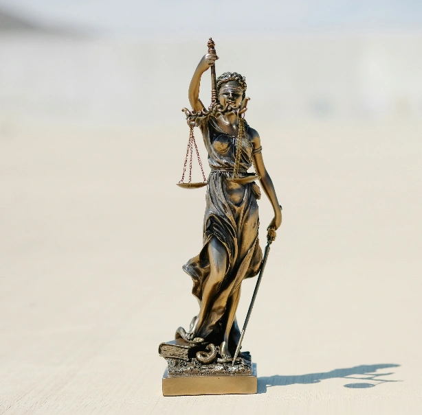 Lady Justice statue with scales and sword.