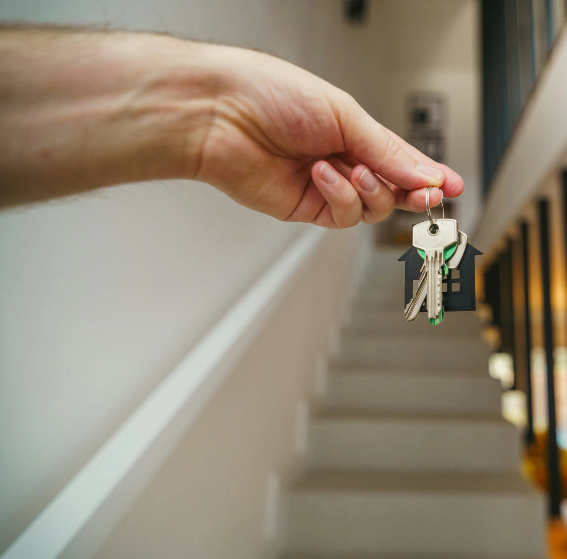 a man holding a bunch of keys